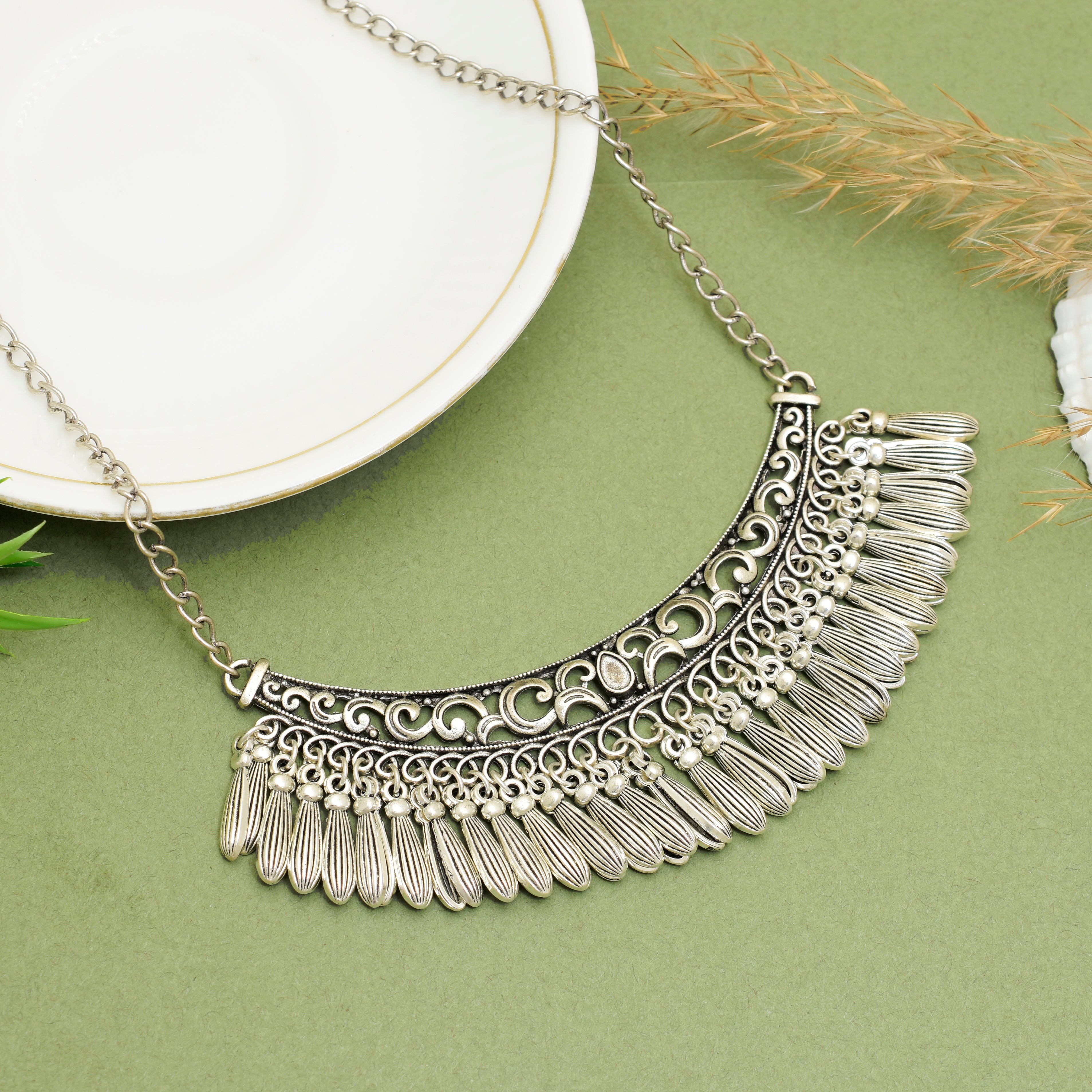 Handcrafted Silver Oxidised Tribal Crescent Bib Choker Necklace with Intricate Geometric Filigree Cut-outs and Textured Feathered Tasselled Drop Hangings for Women and Girls