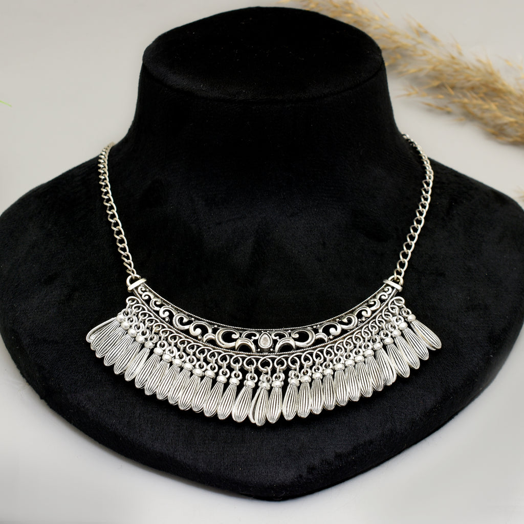 Handcrafted Silver Oxidised Tribal Crescent Bib Choker Necklace with Intricate Geometric Filigree Cut-outs and Textured Feathered Tasselled Drop Hangings for Women and Girls